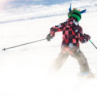 Boy skiing in the mountains